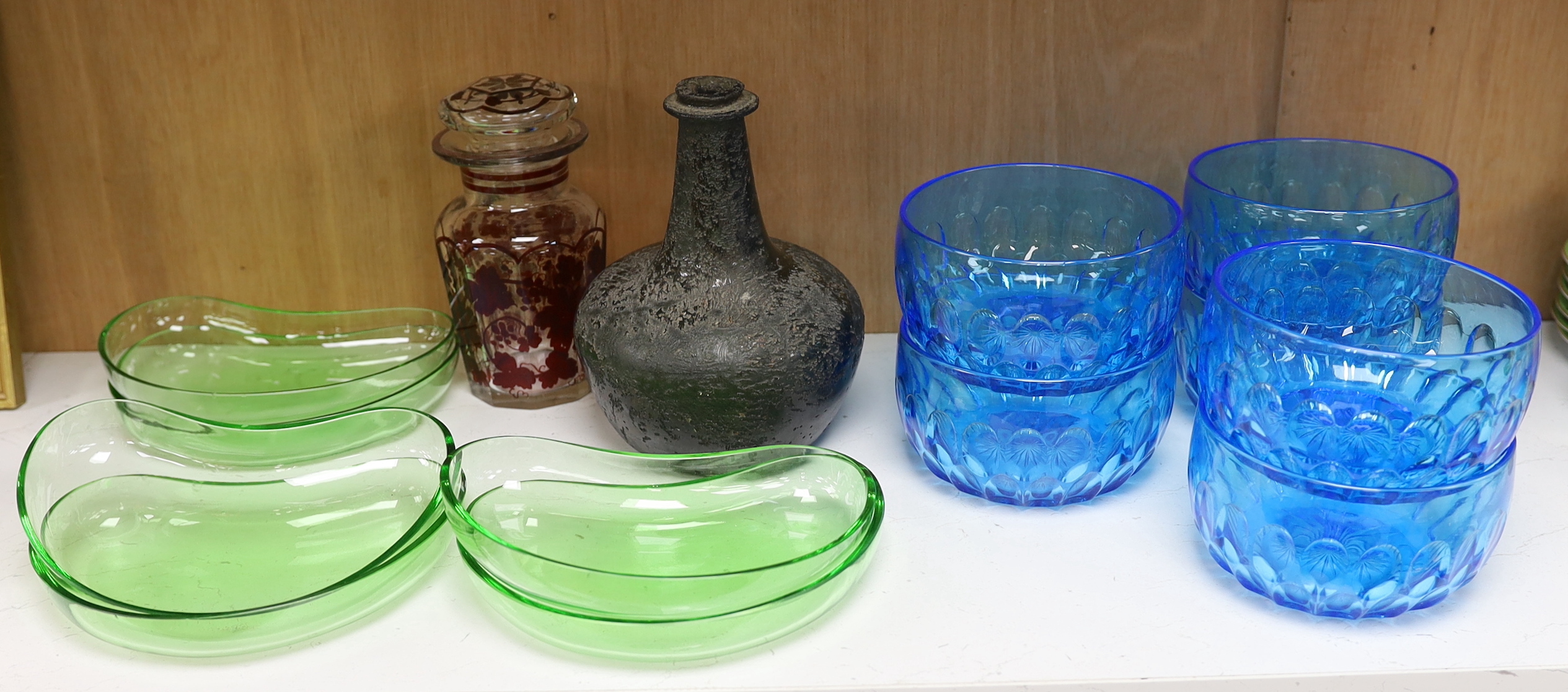 Assorted glassware including an 18th century Dutch onion shaped wine bottle, a set of six blue glass finger bowls and a Bohemian style decanter and stopper, largest 18cm high